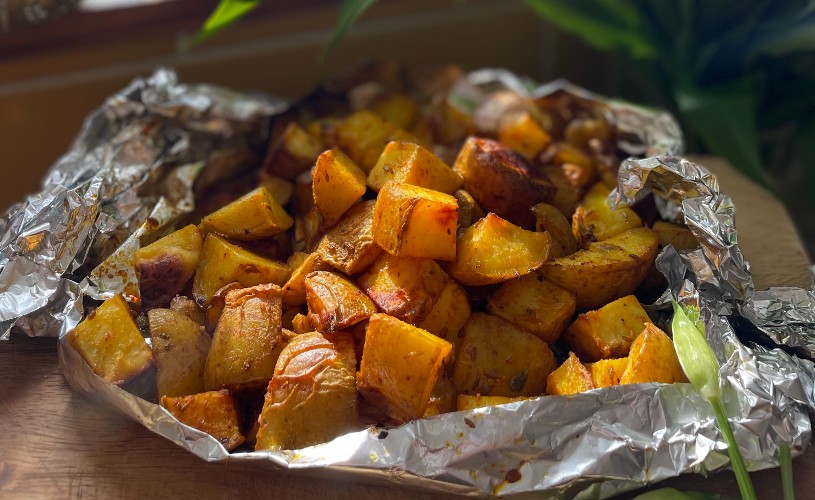 Cooked potatoes in foil